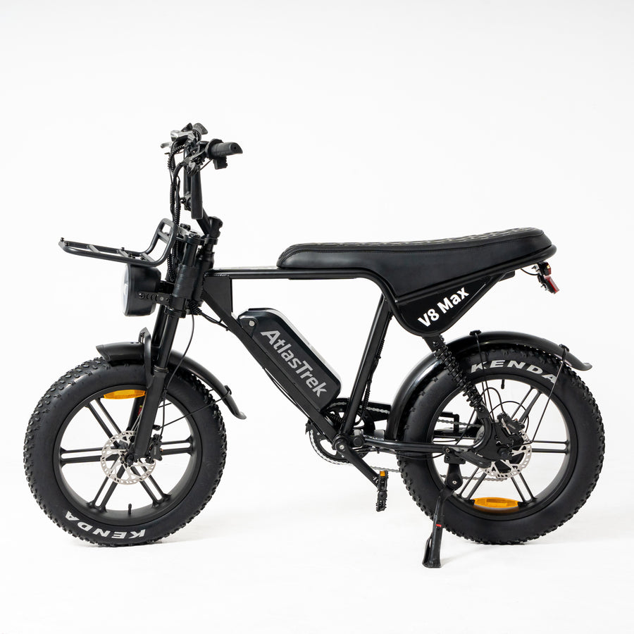 A black AtlasTrek V8 Max electric bicycle with fat tires, rear suspension, and a step-through frame, photographed from a side profile against a clean white background.