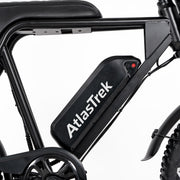 Close-up of a black AtlasTrek electric bicycle frame with a large black battery pack mounted on the downtube, featuring white brand lettering and a small red button detail, set against a plain white background.