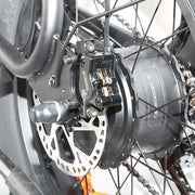 Close-up of a motorcycle wheel with disc brake and gear system
