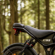 Motorcycle seat with visible branding in a forest setting
