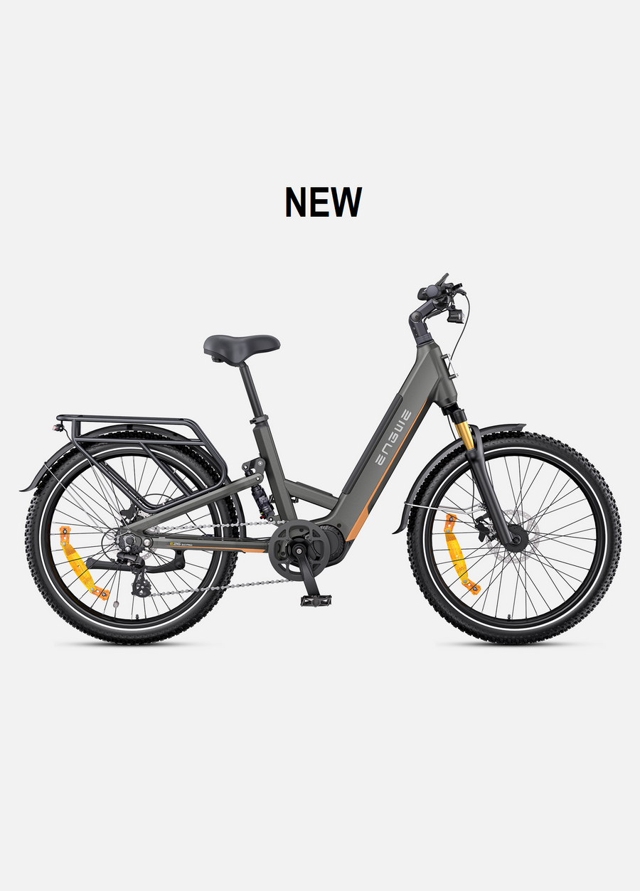 A dark gray step-through electric bicycle with black tires, a black saddle, and orange reflectors, shown from a side profile on a light gray background with the word 'NEW' above it.