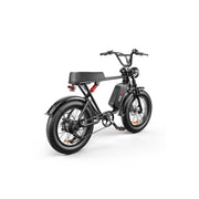 A black electric fat-tire bicycle with a step-through frame, rear cargo seat, and front headlight, shown on a clean white background.