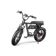 A black electric fat-tire bicycle with a step-through frame, rear suspension, and a visible battery pack mounted on the frame, photographed on a clean white studio background.