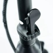 Close-up of a black bicycle handlebar with a brake lever on a white background