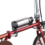 Close-up of a red bicycle with a battery pack attached on a white background