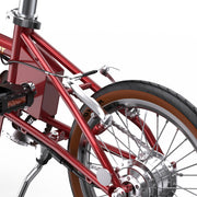 Close-up of a red bicycle frame and wheel on a white background