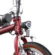 Close-up of a red bicycle with a white background