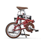 Red folding bicycle with a brown seat and wheels on a white background