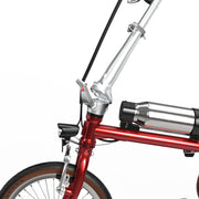 Close-up of a red folding bicycle frame with a silver handlebar, black seatpost, and a cylindrical silver battery mounted on the frame, shown against a plain white background.