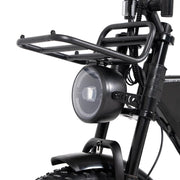 Close-up of a black bicycle with a headlight and rack on a white background