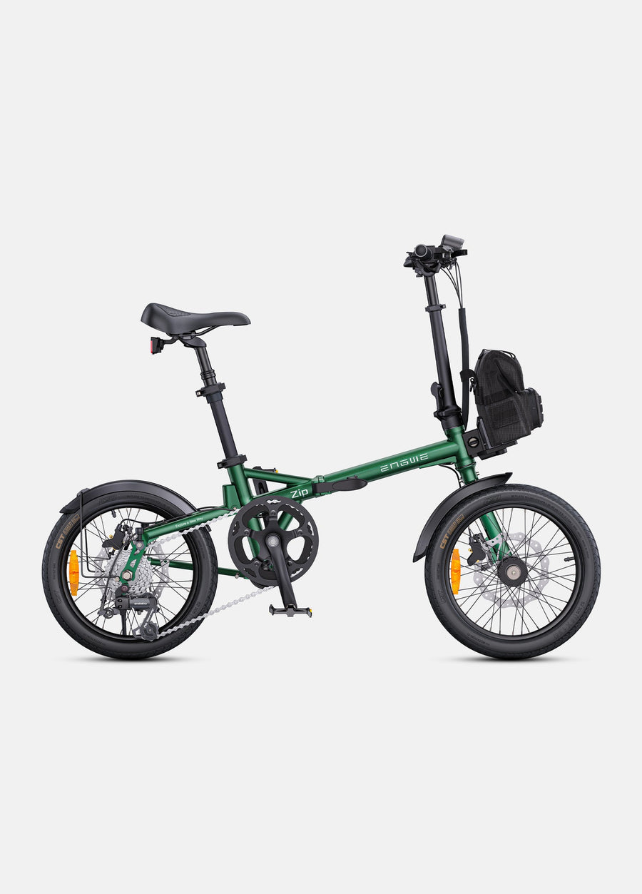 Green folding bicycle on a white background